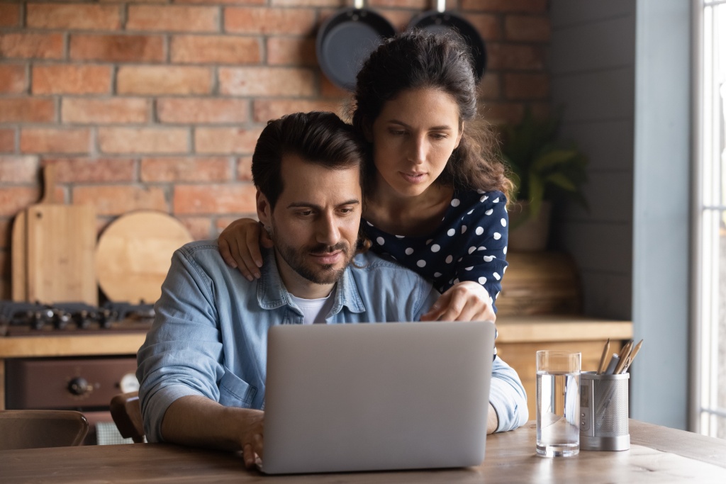 Couple budgeting on computer