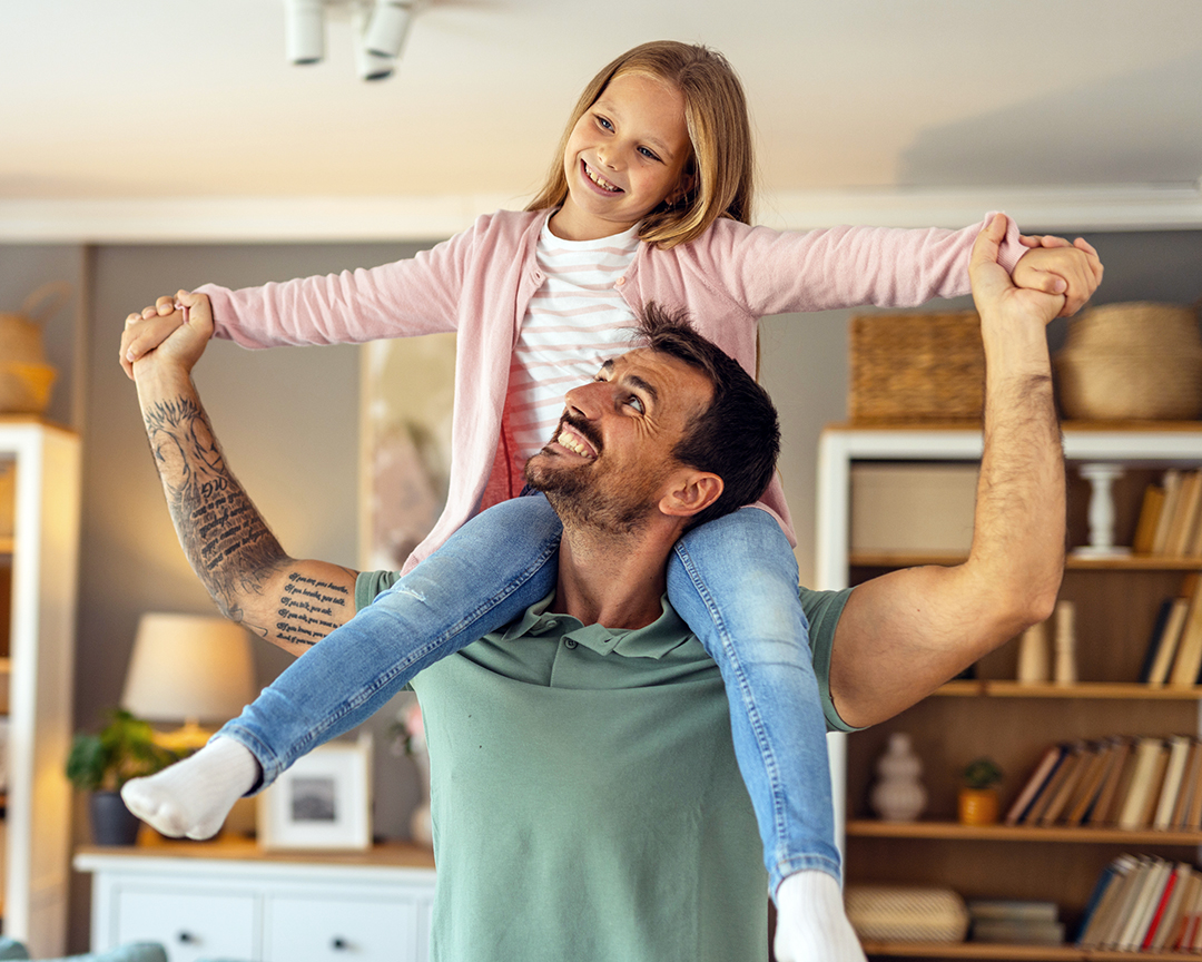 Father and daughter sharing a fun, playful moment